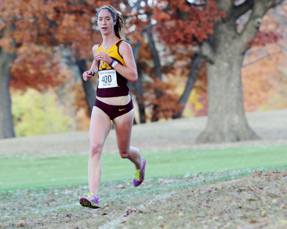 Junior Cassy Opitz runs at the Les Bolstad Golf Course on Saturday. Opitz was the first womens finisher and crossed the line in 22:30.01. 
