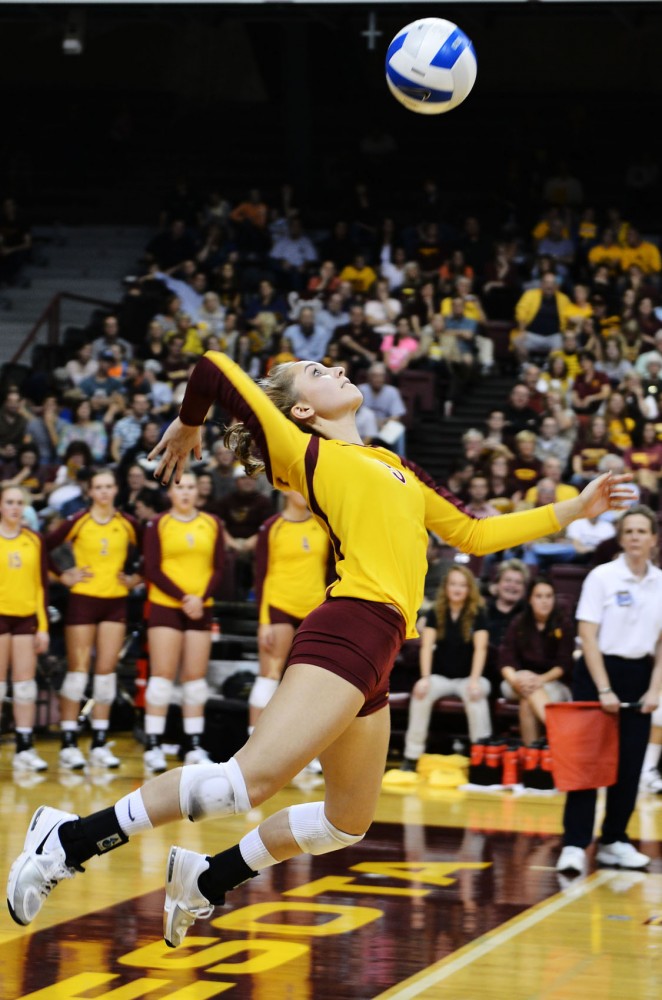 Minnesota defensive specialist Kalysta White serves the ball to Ohio State on Friday at the Sports Pavilion.