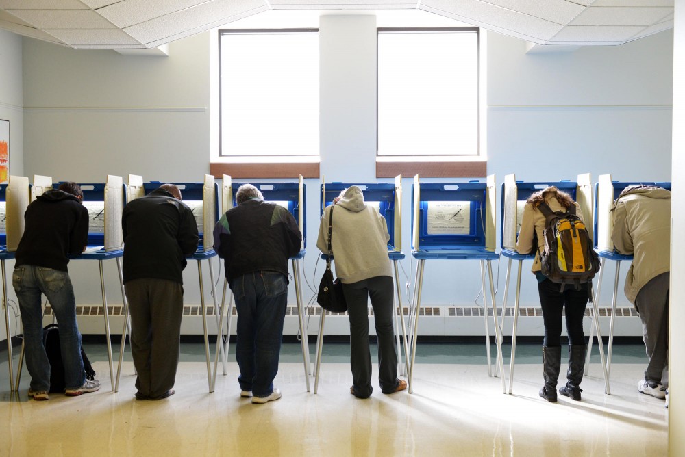 Voters cast their ballots at University Lutheran Church of Hope polling station on Nov. 6, 2012 in Dinkytown. 