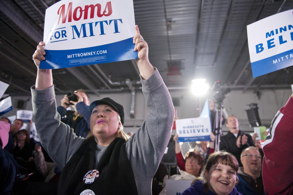 Mitt Romney and Paul Ryan supporters cheer for Ryan on Sunday, Nov. 4, 2012,  at the Sun Country Airlines hanger at the Minneapolis/St. Paul International Airport. 