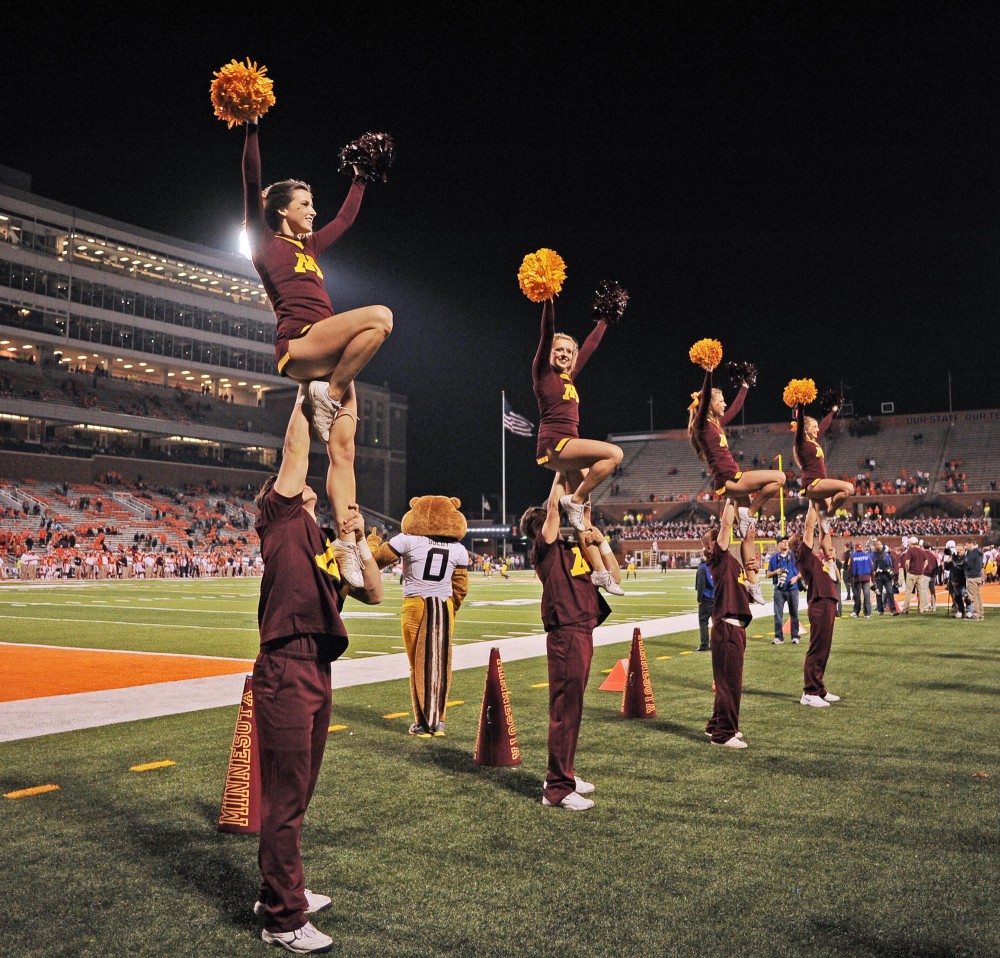 Minnesota cheerleads celebrate after the Gophers second touchdown in the fourth quarter, bringing the score to 17-3 over Illinois on Nov. 10, 2012 at Memorial Stadium in Champaign, Ill.