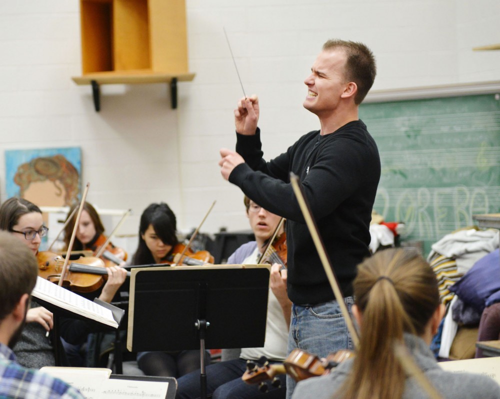 Second-year orchestral conducting doctoral candidate Sergey Bogza conducts the University Symphony Orchestra in playing Tchaikovskys Violin Concerto in D major on Friday in Ferguson Hall. Bogza said he came to Minnesota because of the reputation of its two largest orchestras.