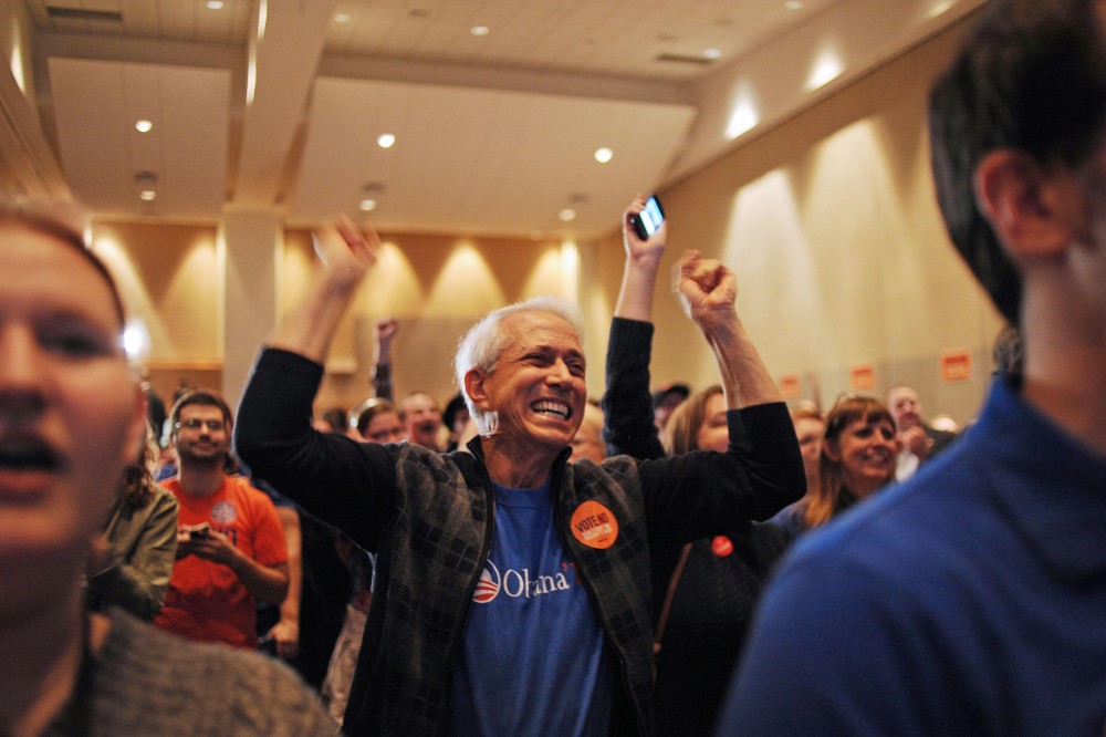 Murray Specktor celebrates as CNN projects Obama as the winner Tuesday night at the Minnesotans United election night party in St. Paul, Minn.