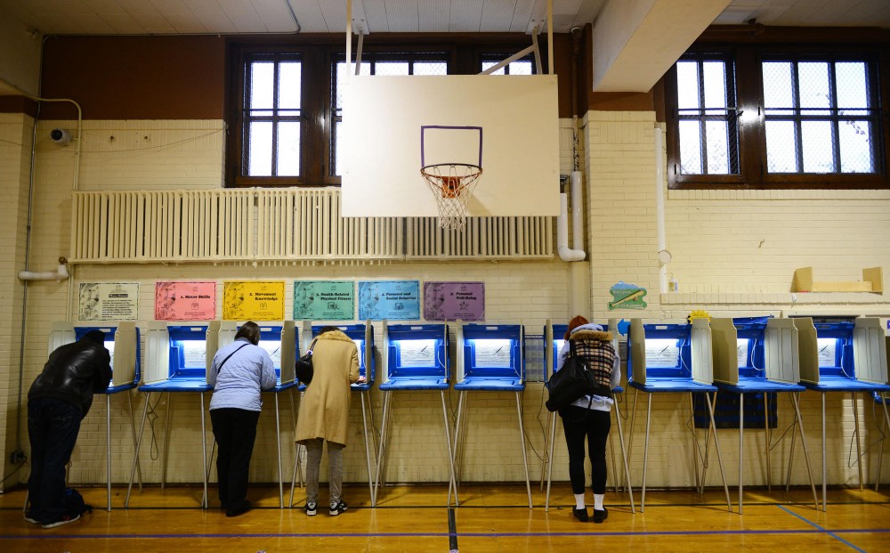 Minneapolis residents cast their ballots at Pratt Community School on Tuesday in Minneapolis. 
