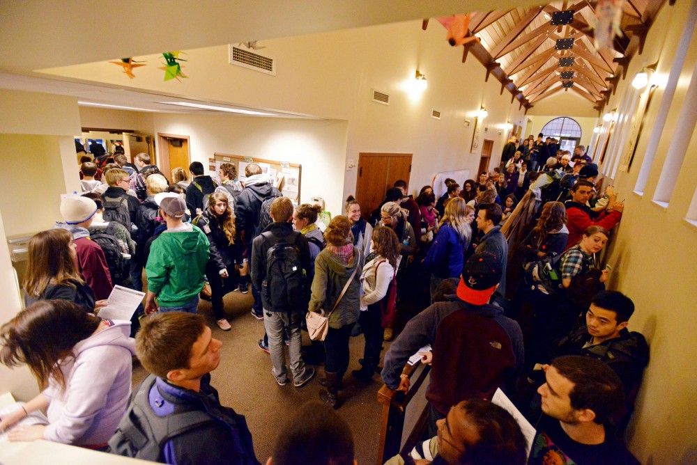 Lines to vote wrap through the hallways of Grace Lutheran Church polling center near the Superblock on Tuesday. The estimated wait at this on-campus polling center was around 45 minutes.
