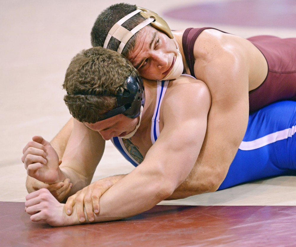 Minnesotas No.10 Scott Schiller won 14-4 against Hofstras Victor Pozsonyi in the 197-pound weight class Friday at the Sports Pavilion. The No. 1 ranked Gophers began their season by defeating Hofstra 32-6.