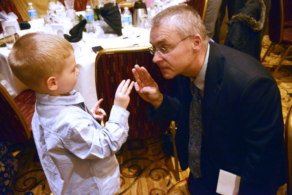 Dr. Jakub Tolar, Associate Professor of Pediatrics in Division of Blood and Marrow Transplant at the Wings of Hope fundraiser brunch with Camden Seymour, brother of Quinn Seymour who passed away because of her rare skin disease, Epidermolysis Bullosa, on Saturday in Maple Grove. EB makes the skin so fragile that it tears away from the body easily causing serious wounds and recurrent blisters. 