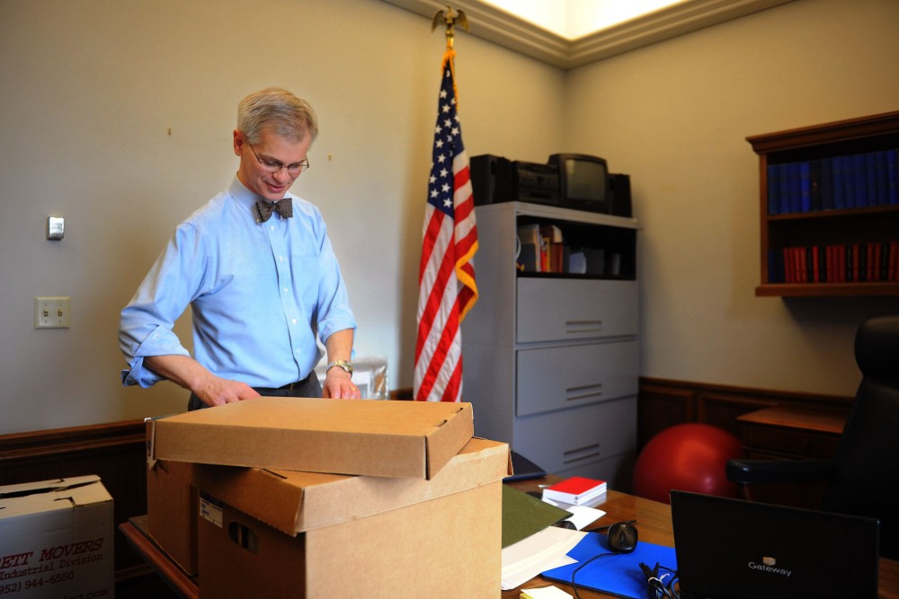State Sen. John Marty goes through boxes of archives Tuesday after moving into his new office at the state Capitol in St. Paul.