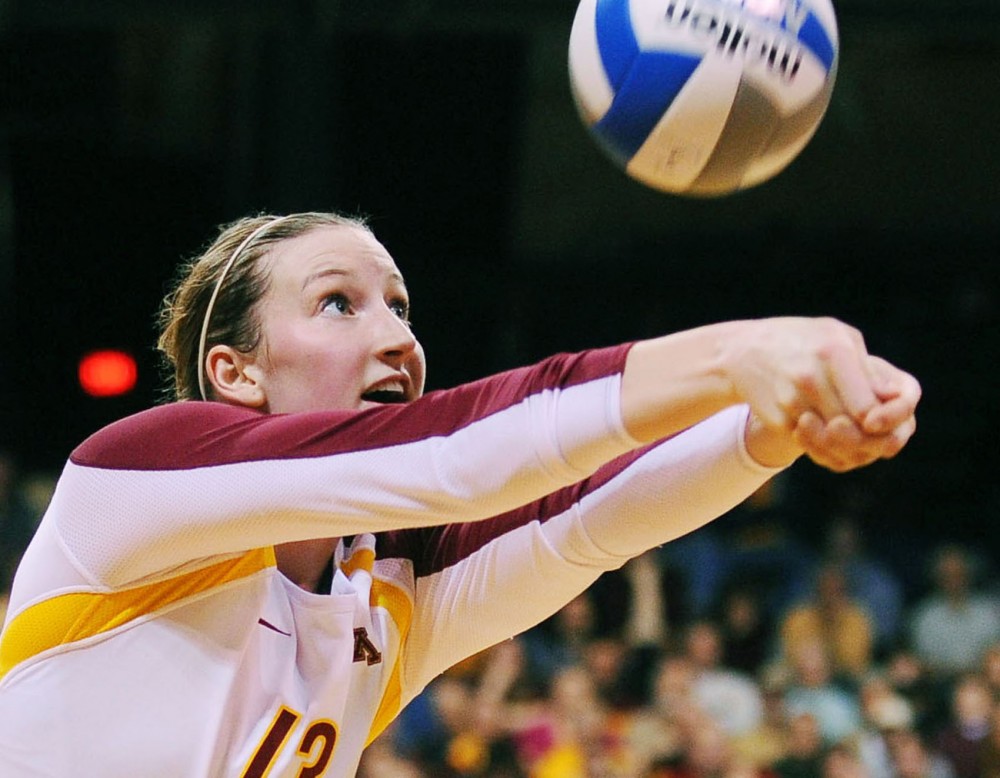 Minnesota outside hitter Ashley Wittman digs the  ball during a match against Liberty on Friday, Nov. 30, 2012, at the Sports Pavilion. 