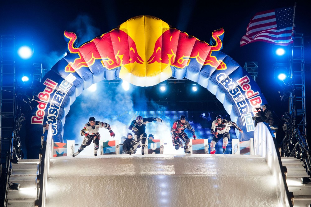 Canadian Kyle Croxall, American Cameron Naasz, Canadian Scott Croxall and Swiss Kim Muller break out of the starting gates during the final round of Red Bull Crashed Ice on Saturday, Jan. 26, 2013, in St. Paul.