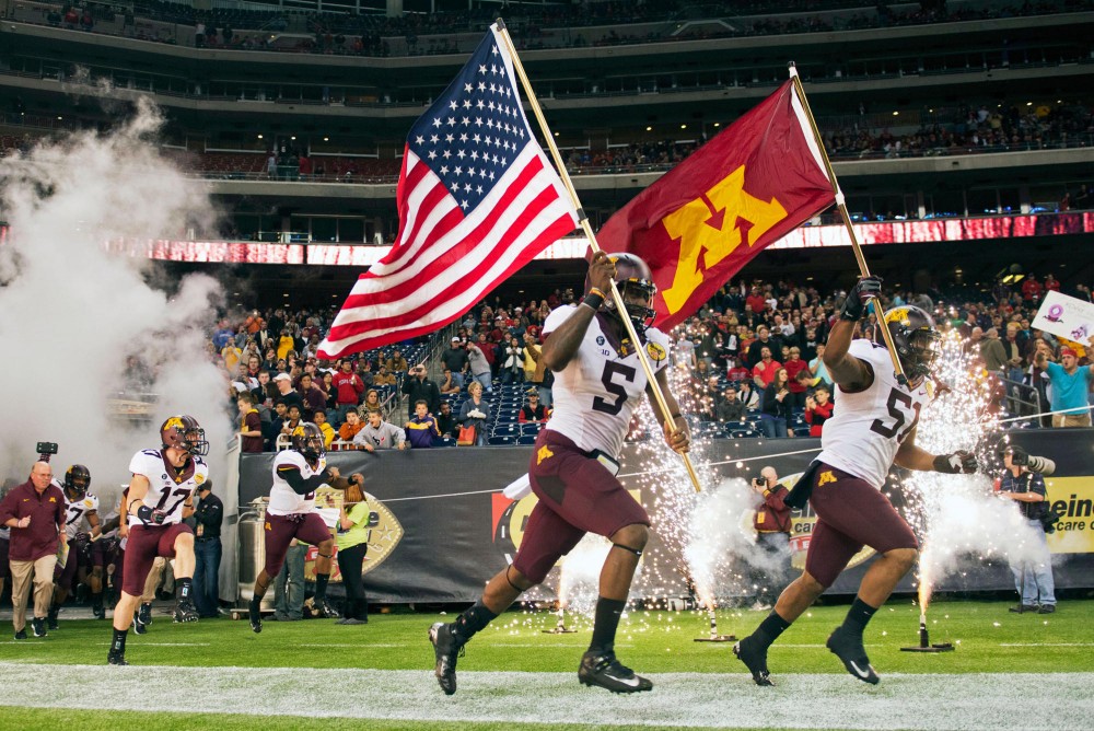 Gophers run onto the field at Reliant Stadium on Friday, Dec. 28, 2012 in Houston, Texas.