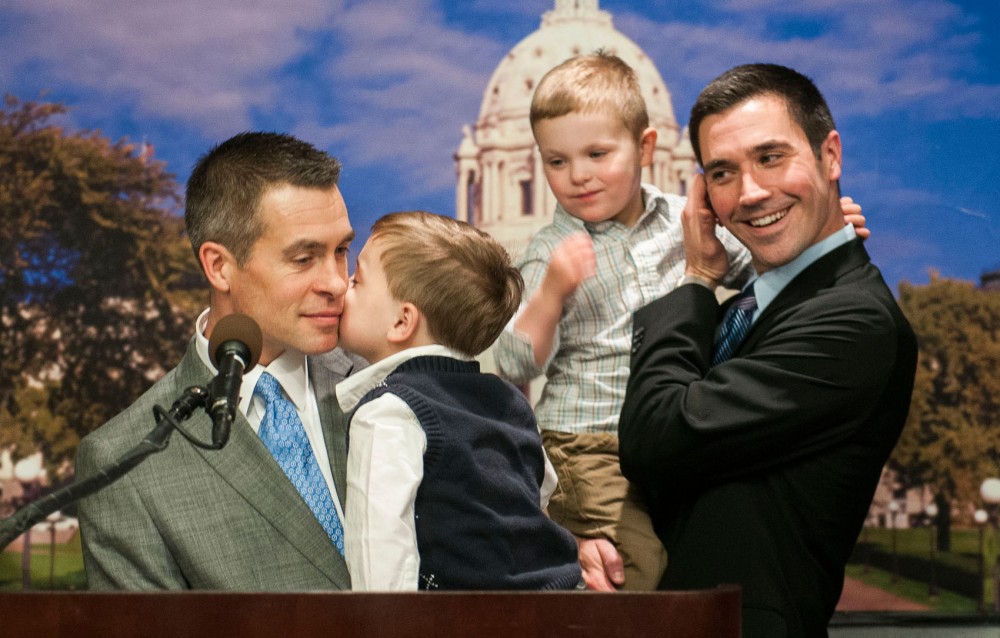 Paul Melchert (left), a pediatrician, speaks to the media about his support of the legalization of gay marriage while accompanied with his partner James Zimmerman (far right), and their two sons, Emmett (left), and Gabriel Melchert-Zimmerman (right). Sen. Scott Dibble and Rep. Karen Clark, chief sponsors of the bill to legalize gay marriage in Minnesota, held a press conference introducing their bill Wednesday at the Capitol. 