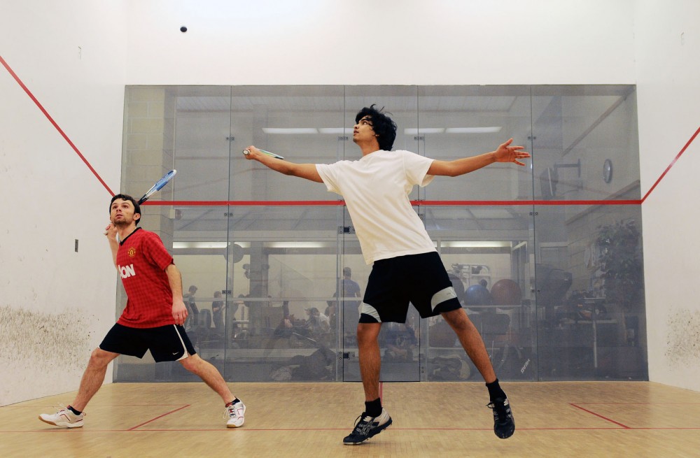 Senior Mikael Rellier, left, and sophomore Tarun Nambiar, captain of the men’s squash team, practice Monday, Feb. 11, 2013, at the University Recreation Center. The men’s and women’s teams will compete at the national tournament for the second consecutive year. 