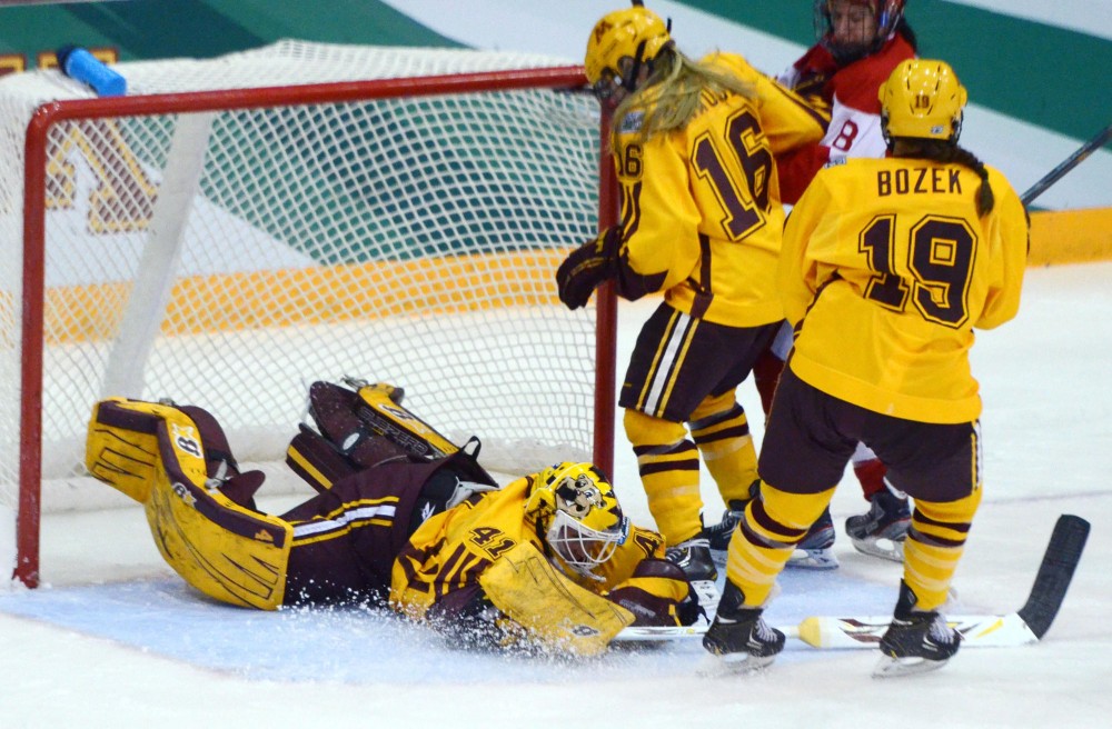 Minnesota goalie Noora Raty saves a shot a the goal, Saturday during the NCAA title game at Ridder Arena.