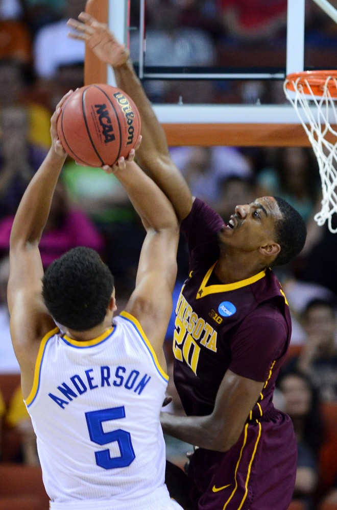Minnesota guard Austin Hollins (20) blocks a shot from UCLA forward Kyle Anderson Friday, March 22, 2013 at the Frank Erwin Center in Austin, Texas. The Gophers defeated the Bruins 83-63 and will continue to the next round.
