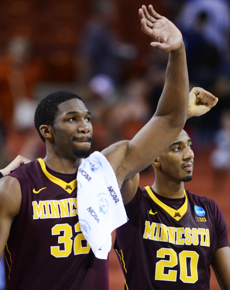 Minnesota forward Trevor Mbakwe (32) and Minnesota guard Austin Hollins (20) wave to fans after their victory against UCLA on Friday, March 22, 2013 at the Frank Erwin Center in Austin, Texas. The Gophers defeated the Bruins 83-63 and will continue to the next round.