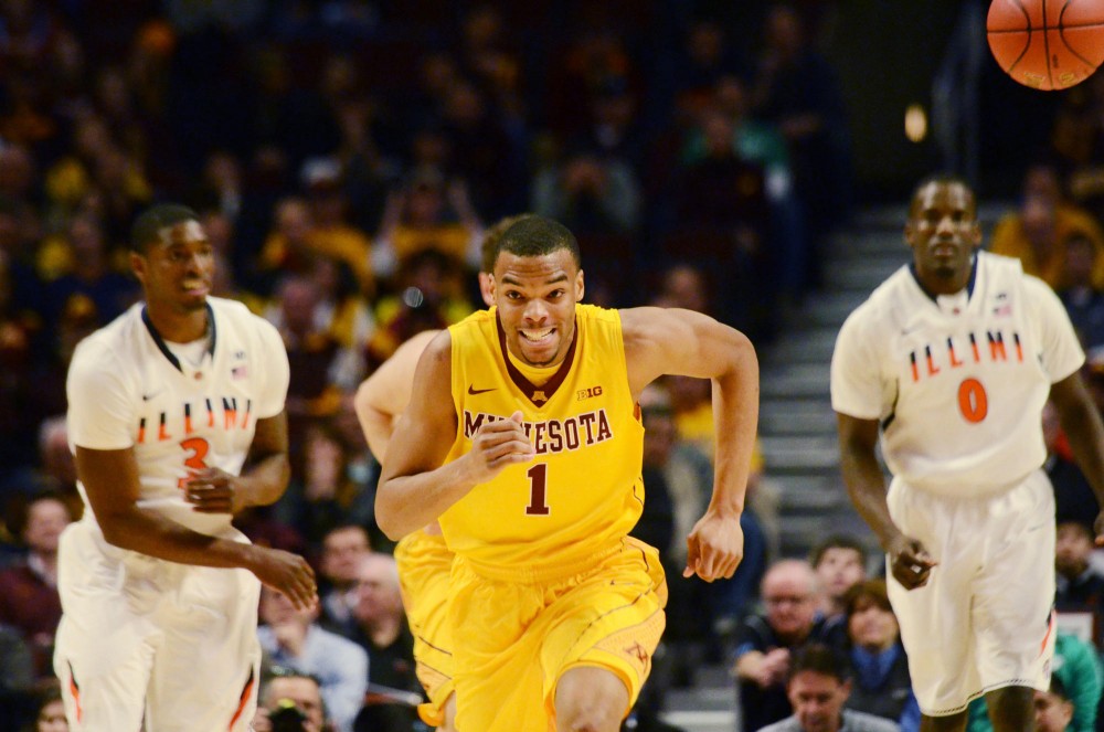 Minnesota guard Andre Hollins chases the ball during the first game of the Big Ten Tournament at the United Center in Chicago, Illinois, Thursday. 