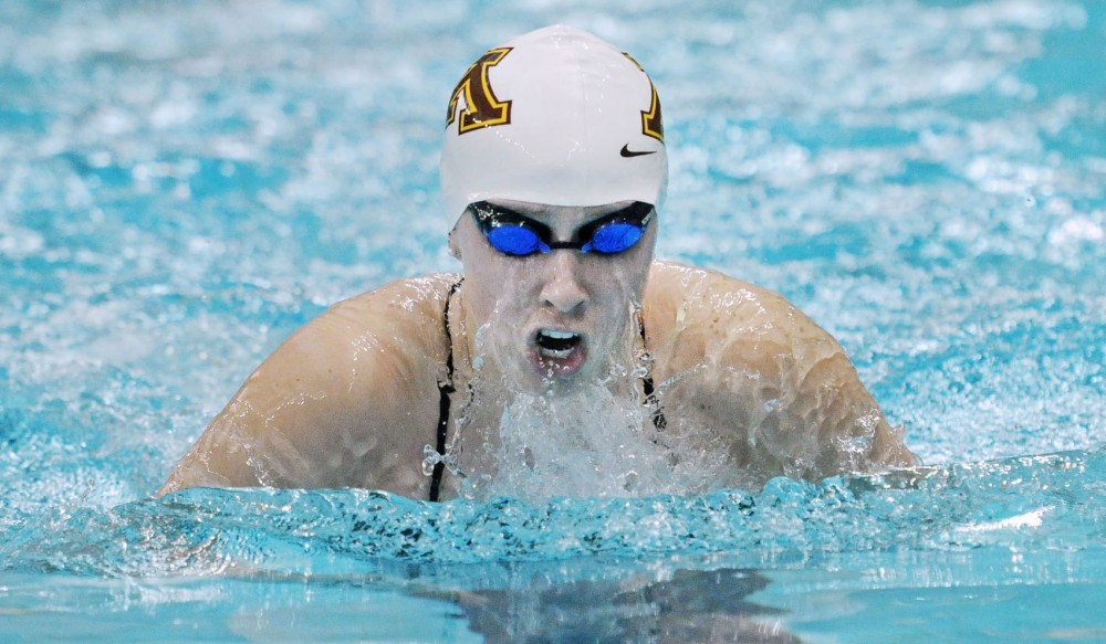 Haley Spencer swims the womens 100-yard breaststroke Saturday, Dec. 1, 2012, at the University Aquatic Center.