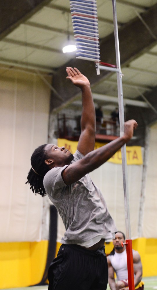Former Gophers defensive back Michael Carter measures his jump during Pro Day on Monday, March 4, 2013, at the Gibson-Nagurski Football Complex. Several players from the Gophers 2012 football team went through a series of drills and measurements in front of NFL scouts.