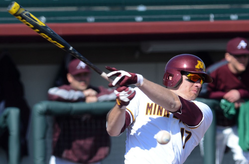 Minnesotas JT Canakes hits a foul ball against Augsburg on Tuesday, April 16, 2013 at Siebert Field.