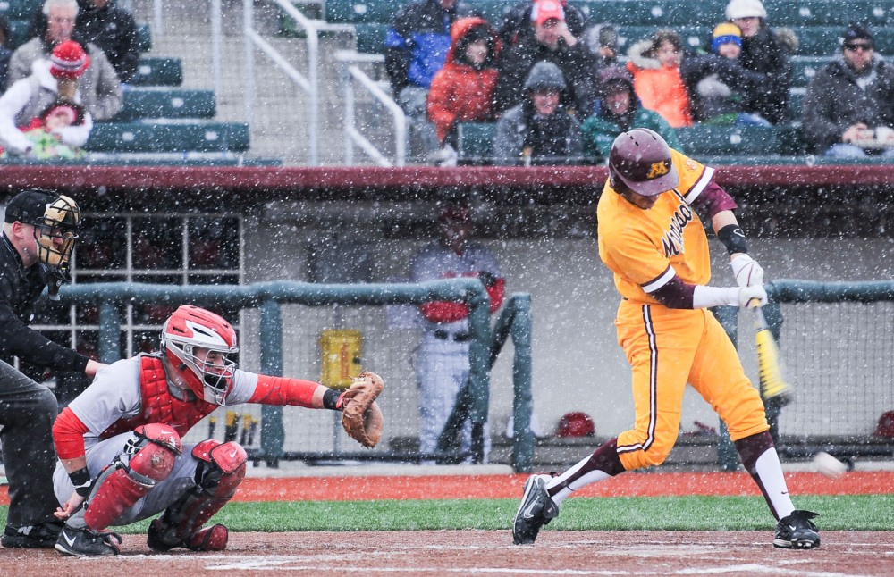 Minnesota short stop Michael Handel hits the ball for a base run against Ohio State Buckeyes on Friday, April 5, 2013, at Siebert Field. 
