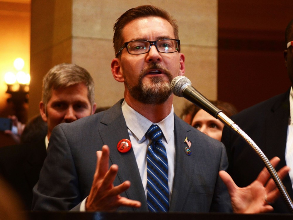 Scott Dibble, senate author of the bill, speaks to the packed crowd after it is announced that the bill had passed, Monday afternoon.