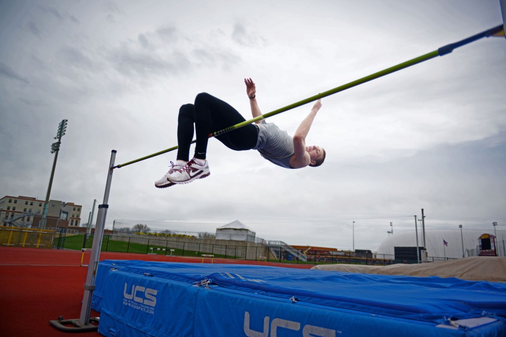 Minnesota high jumper Wally Ellenson practices at Bierman Athletic Field on Tuesday, April 30, 2013. Ellenson is a two-sport athlete, competing in both basketball and track and field for the Gophers.