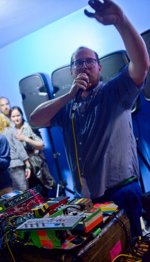 Dan Deacon performs live in the parking garage of The Walker Art Center during the Rock the Garden concert on Saturday June 15th, 2013. Attendees sought shelter from the rainstorm that overshadowed the the beginning of the festival.