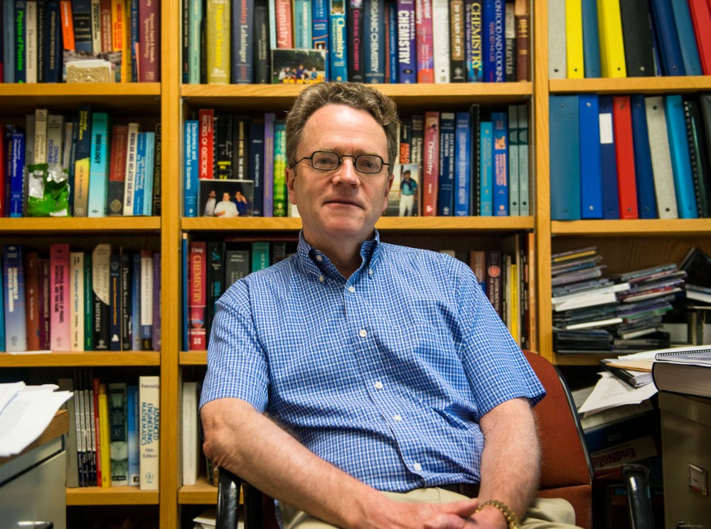 Physics professor Tim Lodge in his office Monday, July 8, 2013, in Smith Hall. Professor Lodge and Professor Stephen Polanksy were both awarded a Regent Professorship in June.