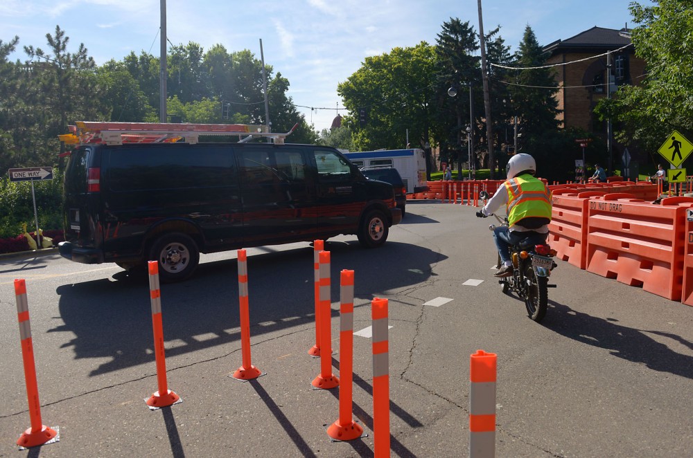 Vehicles circle a temporary roundabout installed by Parking and Transportation Services recently at the intersection of Pleasant Street and Pillsbury Drive. Officials are monitoring the effectiveness of the roundabout which will last until August 21. 