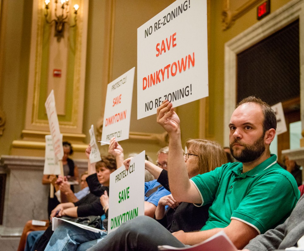 during a city council meeting \date\ at Minneapolis City Hall. The re-zoning of the Dinkytown area, which would allow the OPUS development project, was approved in a 9-4 vote.