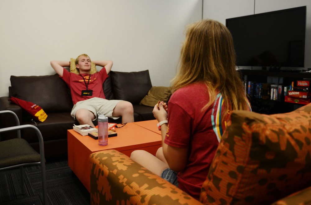 Sophomore Kevin Ward, left, and sophomore Emily Myers, right, take a break from their Welcome Week duties Thursday morning in the new office for the student group Commuter Connection, located in Coffman Union. Their student group regained an office on Coffmans second floor after the summer renovation.