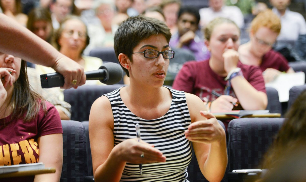 Junior Salma Taleb asks the panel a question at Countering Mass Atrocities in Syria: Between Human Rights Ideals and Geo-Political Concerns at Wiley Hall on Wednesday afternoon. The panel held a discussion on what consequences U.S. interference in Syria would bring.