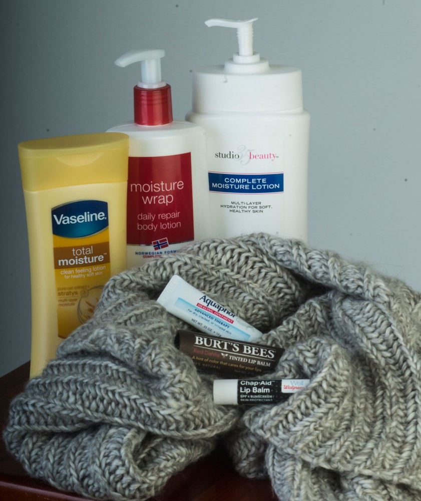 Protect yourself! From top left: Vaseline Total Moisture, Neutrogena Moisture Wrap and Studio 35 Complete Moisture Lotion. On the scarf, from top: Aquaphor, Burts Bees and generic Walgreens chapstick.