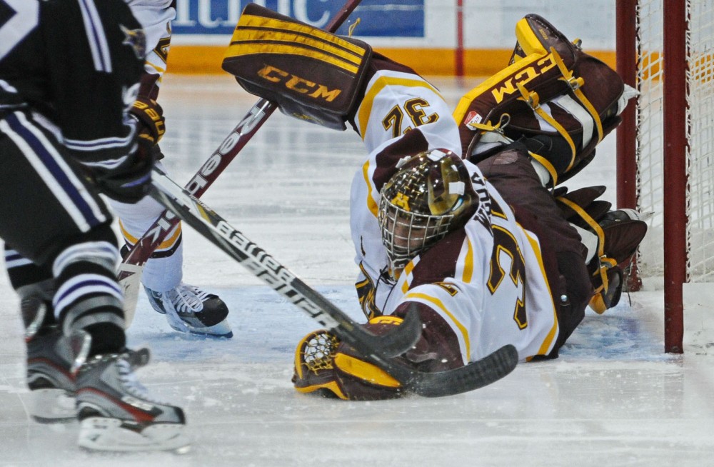 Minnesota goalie Adam Wilcox grabs the puck during a game against Minnesota State on Friday, Nov. 2, 2012, at Mariucci Arena. 