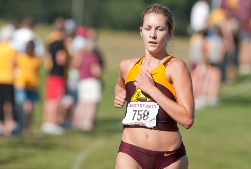 Sophomore Laura Docherty runs in the Oz Memorial Friday Sept. 9 at the Les Bolstad golf course in St. Paul. 