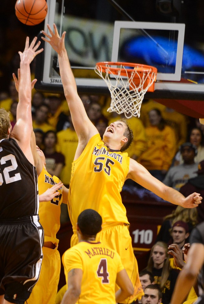 Gophers junior center Elliott Eliason blocks a shot against Lehigh at Williams Arena on Friday. Eliason recorded the first double-double of his career in the game.