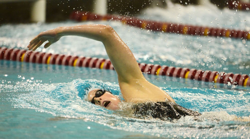 Minnesota freshman Breanne Siwicki completes the 200-meter backstroke against University of Michigan on Friday, Oct. 11, 2013. 
