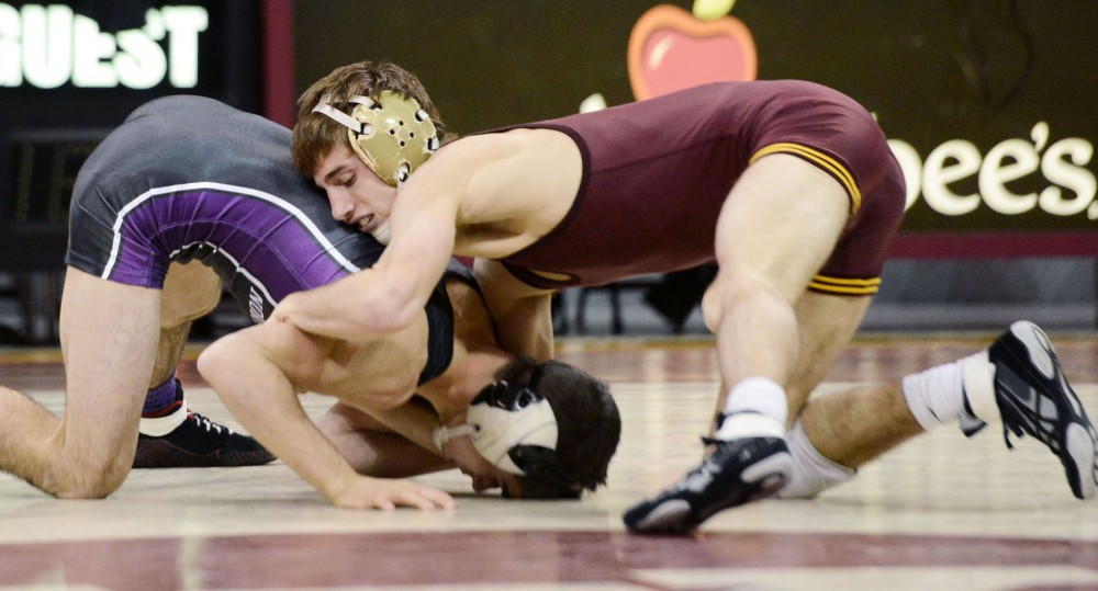 Minnesotas David Thorn wrestles Northwesterns Dominick Malone on Friday, Dec. 7, 2012, at the Sports Pavilion. Thorns younger brother, Tommy Thorn, signed a national letter of intent with the Gophers last week. 