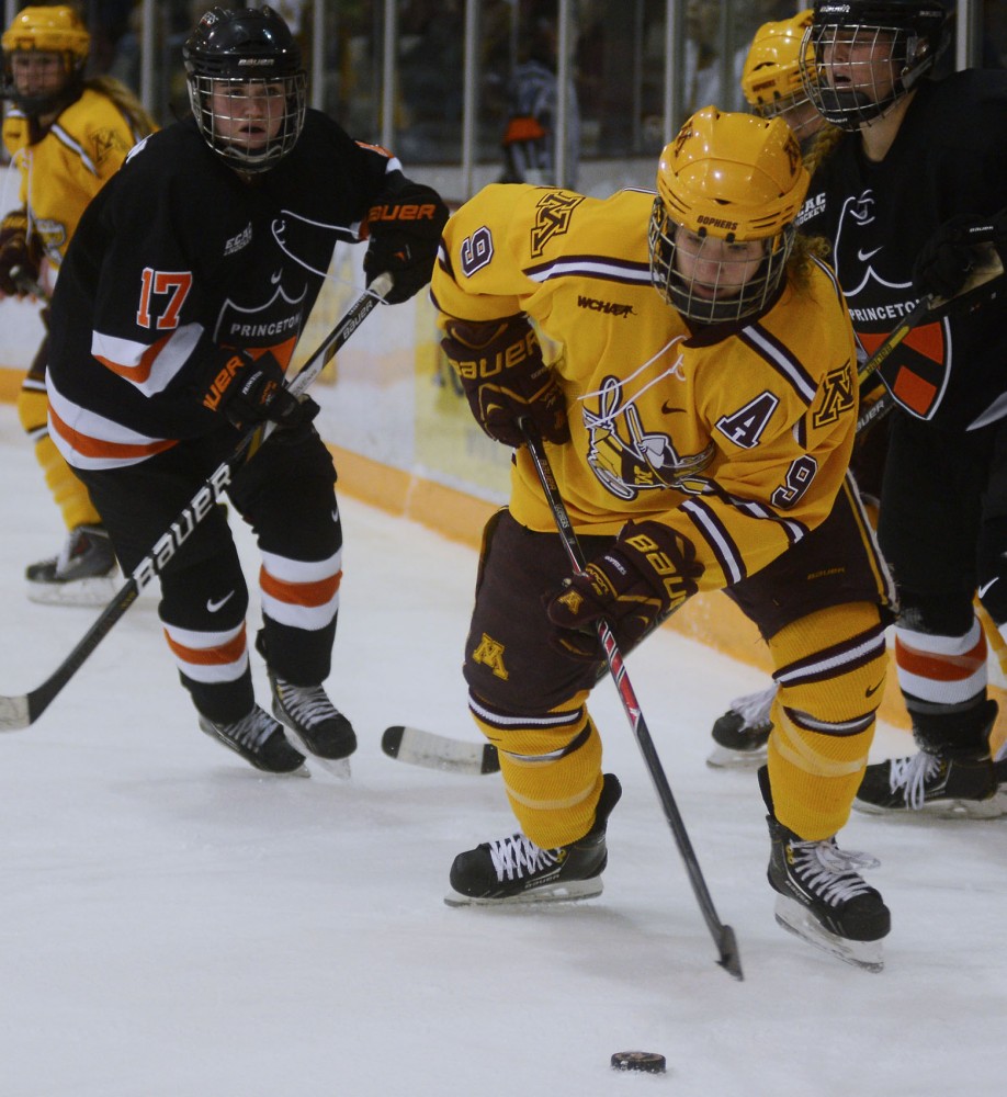 Forward Sarah Davis controls the puck at the Womens Hockey game against Princeton on Sunday. 