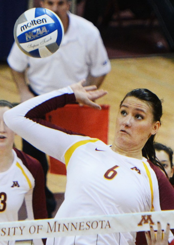 Gophers middle blocker Tori Dixon spikes the ball against Radford in the first round of the NCAA tournament at the Sports Pavilion on Friday, Dec. 6, 2013.