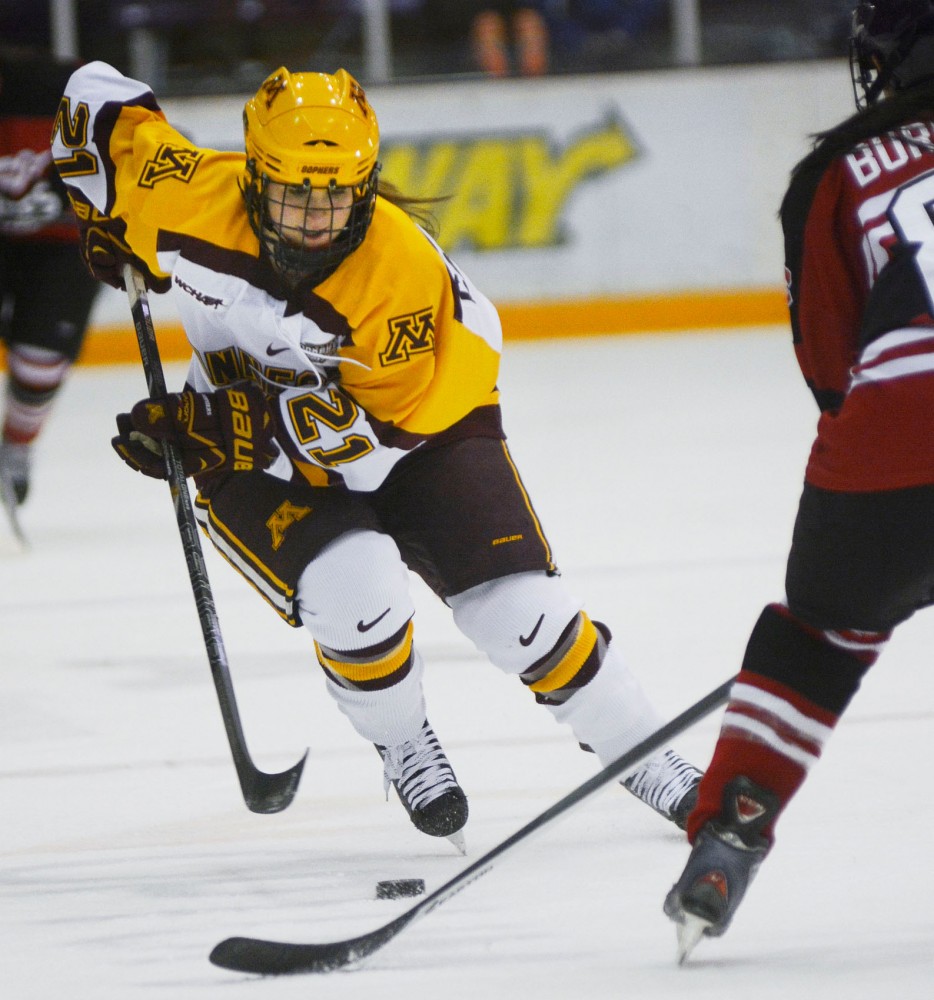 Gopher forward Dani Cameranesi moves the puck toward the net against St. Cloud at Ridder Arena on Saturday. The Gophers won 3-1.
