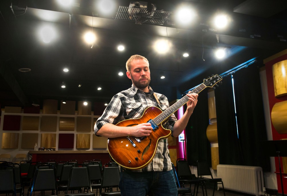Jazz guitarist Zacc Harris strums a melody with his Sadowsky guitar at Studio Z in St. Pauls Lowertown Arts District.  His label, Shifting Paradigm Records, is holding a release party on Saturday.