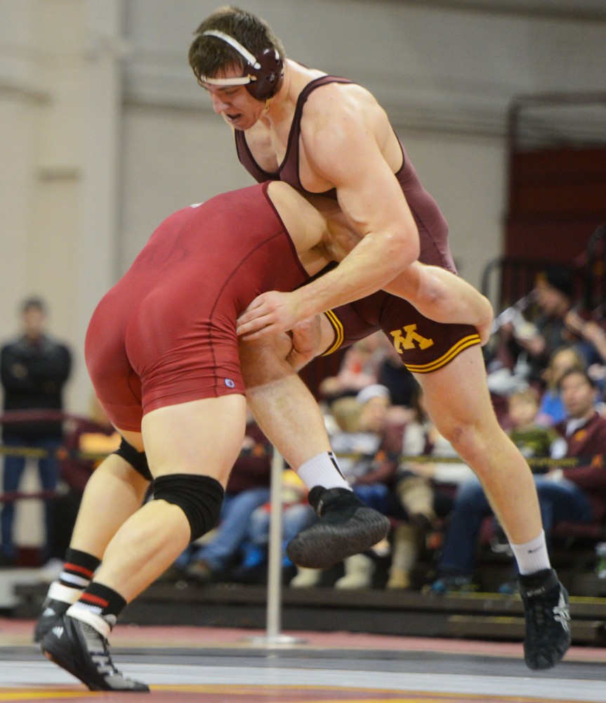 Minnesota senior Tony Nelson wrestles his opponent during the meet against Indiana at the Sports Pavilion on Sunday, Feb. 2, 2014.