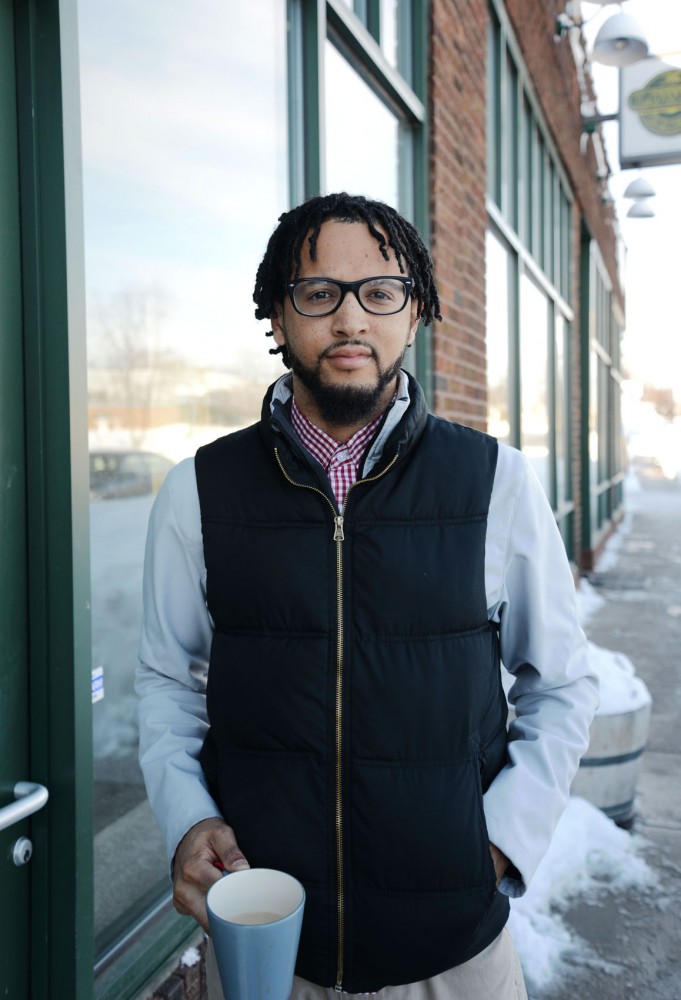 Local poet and activist Chaun Webster stands outside of his future bookstore in north Minneapolis on Tuesday. Webster and his wife are opening the only bookstore in the neighborhood, and it will only sell work by authors of color.