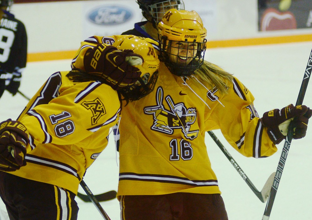 Minnesota forwards Brook Garzone and Bethany Brausen celebrate a goal at Ridder Arena on Nov. 22, 2013.