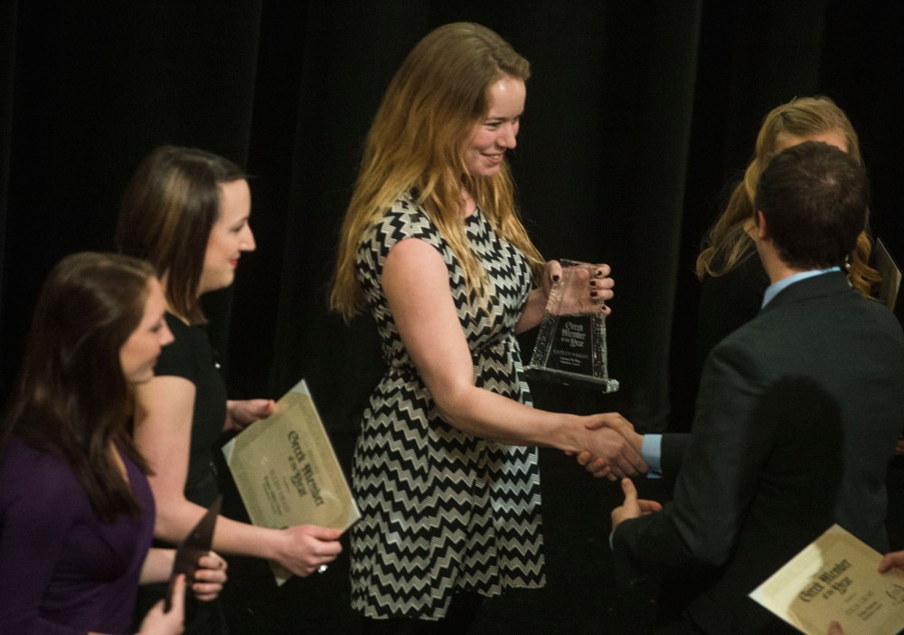 Katelyn Wright of Gamma Phi Beta smiles as she accepts the PHC Greek Member of the Year award at the Greek Awards on Sunday at Coffman Union.