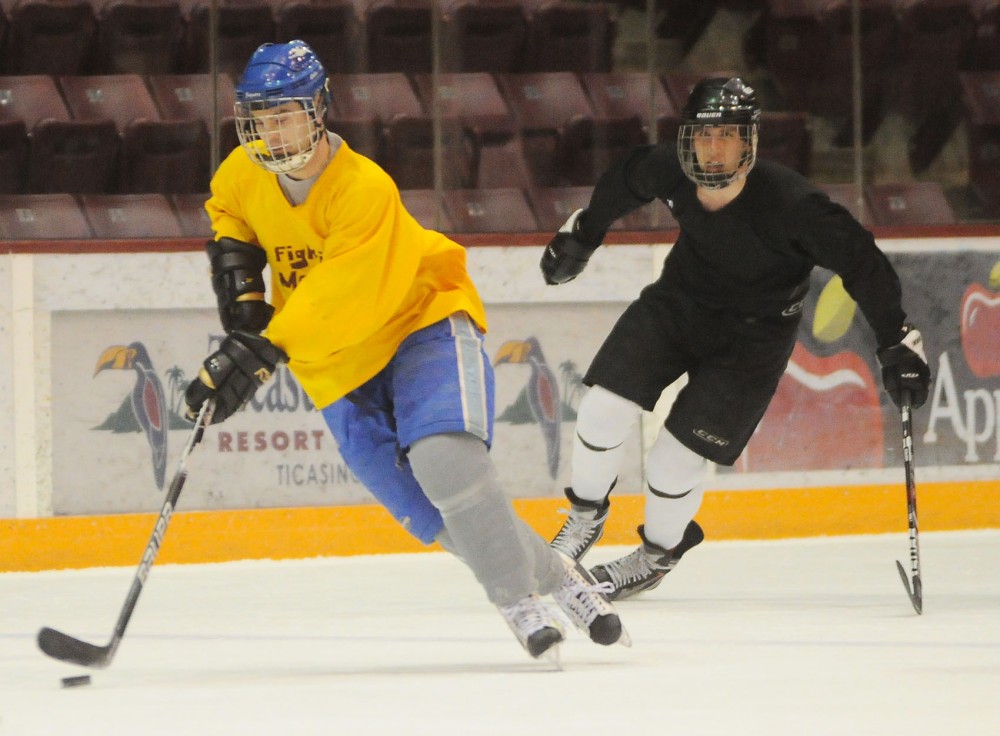 The Fighting Mondales play the University ROTC team in intramural hockey Monday, Feb. 10, 2014, at Mariucci Arena.