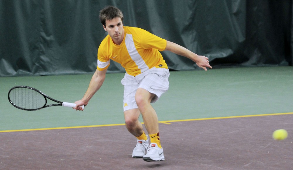 Minnesota junior Mathieu Froment plays doubles against Drake at the Baseline Tennis Center on Saturday, Feb. 22, 2014.