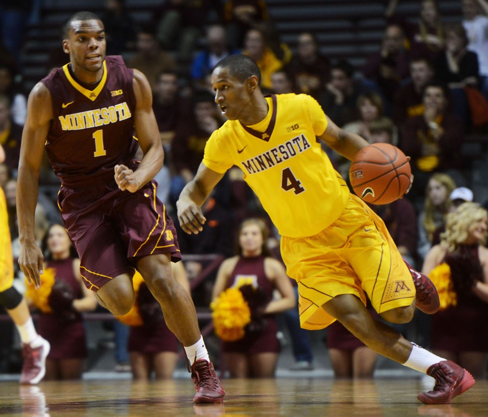 Gophers junior guard DeAndre Mathieu dribbles up the court at Williams Arena on Friday, Oct. 18, 2013.